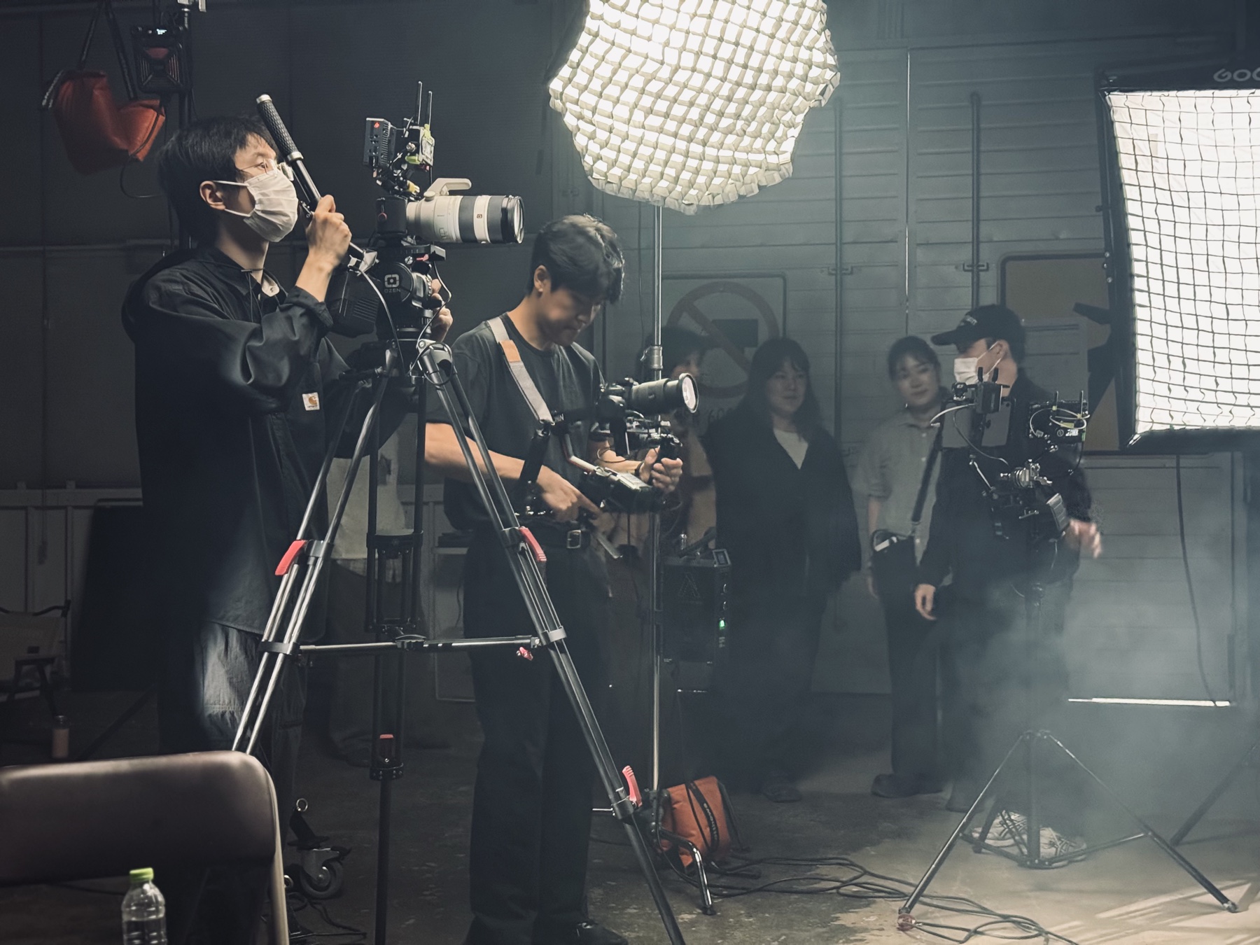 Jun Hee Lee operating a camera on set
